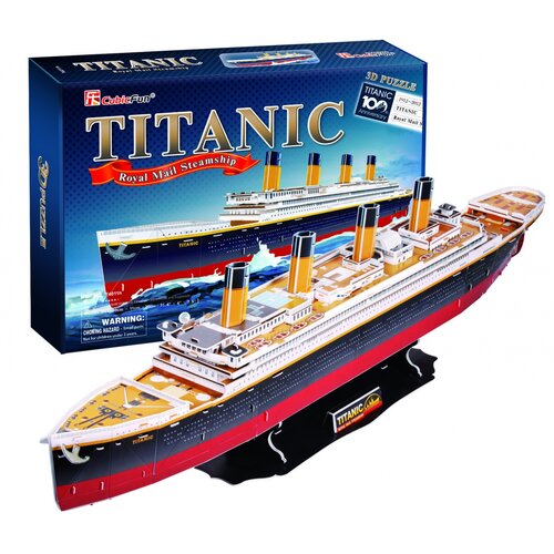 Pudełko przedstawia model statku Titanic z napisem "CubicFun" oraz "TITANIC Royal Mail Steamship" na niebieskim tle. Obok pudełka znajduje się złożony model 3D statku z widocznymi szczegółami, takimi jak kominy i pokład, a na podstawce widnieje napis "TIT