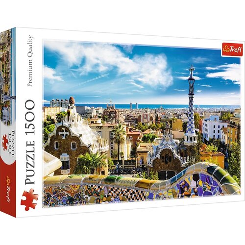 Pudełko puzzli przedstawia kolorowy widok na Park Güell w Barcelonie z charakterystycznymi mozaikowymi budowlami na tle miasta i nieba. Na opakowaniu widnieje napis "Puzzle 1500" oraz logo "Trefl".
