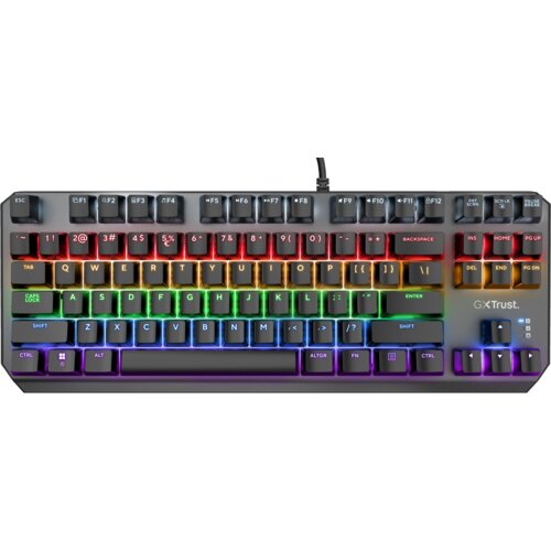 Na zdjęciu znajduje się klawiatura mechaniczna z podświetleniem RGB, z widocznymi klawiszami oznaczonymi literami, cyframi i symbolami. Na obudowie klawiatury widnieje logo "GXT Trust".