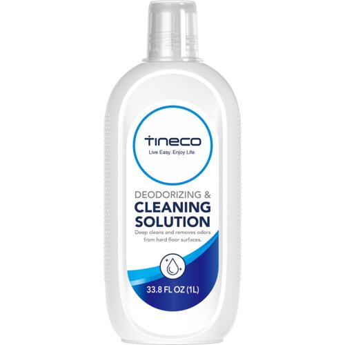 Biała butelka z przezroczystą nakrętką zawiera płyn do czyszczenia i dezodoryzacji podłóg, oznaczony jako "Tineco Deodorizing & Cleaning Solution". Na etykiecie widnieje napis "Deep cleans and removes odors from hard floor surfaces" oraz pojemność "33.8 F