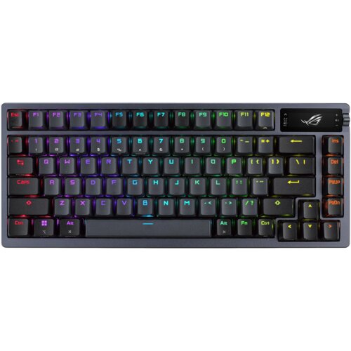 Czarna klawiatura mechaniczna z podświetleniem RGB, posiadająca klawisze funkcyjne od F1 do F12 oraz klawisze numeryczne od 1 do 0. W prawym górnym rogu widoczne jest logo ROG.