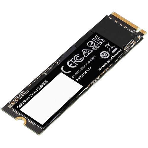 Na zdjęciu znajduje się dysk SSD w formacie M.2 z widocznymi oznaczeniami CE, FCC oraz informacją "RATED DC 3.3V". Na etykiecie widnieje napis "Solid State Drive" oraz ostrzeżenie "Warranty Void If Removed".