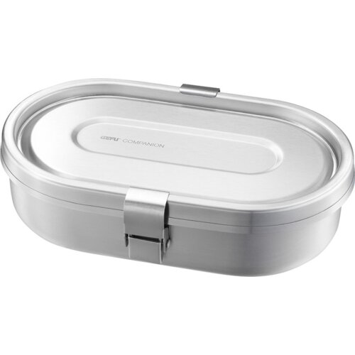 Na zdjęciu widoczny jest metalowy lunch box o owalnym kształcie z zamknięciem na klips. Na pokrywie znajduje się napis "GEFU COMPANION".