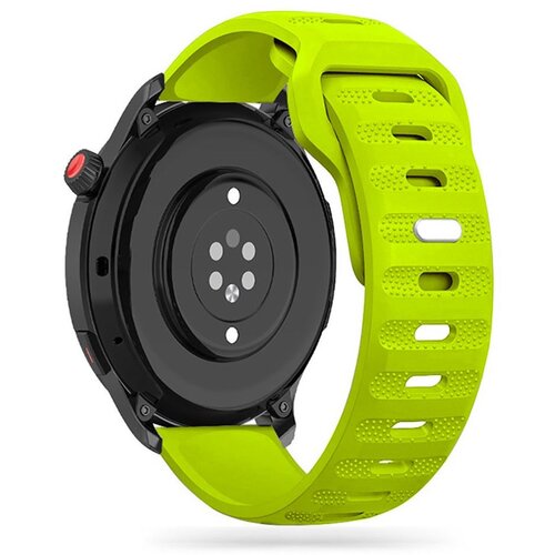 Limonkowy pasek TECH-PROTECT IconBand Line jest przymocowany do czarnej koperty zegarka, która ma okrągły kształt i kilka czujników na spodzie. Pasek posiada perforacje i teksturowaną powierzchnię.