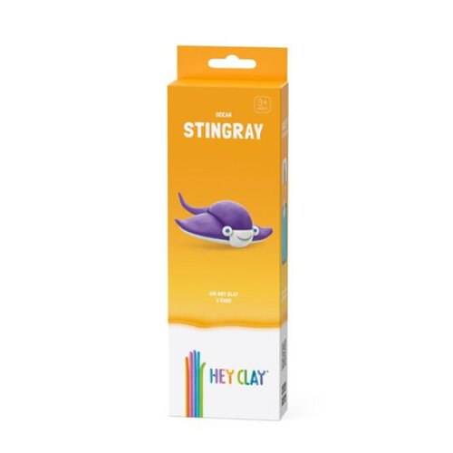 Pomarańczowe opakowanie produktu z napisem "OCEAN STINGRAY" oraz ilustracją fioletowej płaszczki. Na dole opakowania znajduje się logo "HEY CLAY" z kolorowymi paskami.