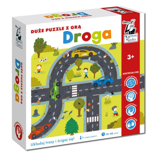 Pudełko gry planszowej "Droga" z dużymi puzzlami, na którym widoczna jest ilustracja przedstawiająca drogę z samochodami i postaciami na tle zielonego krajobrazu. Na opakowaniu znajdują się napisy: "DUŻE PUZZLE Z GRĄ Droga", "Kapitan Nauka", "3+", "Układa