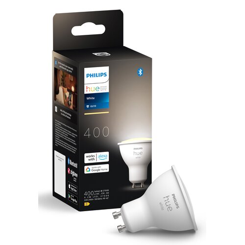Opakowanie produktu "PHILIPS hue White GU10" z widocznymi oznaczeniami: "400 lumenów @ 2700K", "works with Alexa", "works with Google Home", oraz logotypy Bluetooth i Zigbee. Obok opakowania znajduje się żarówka z napisem "PHILIPS hue white".