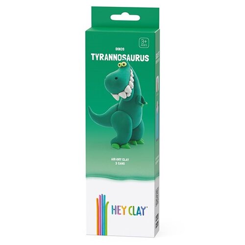 Zielone opakowanie produktu "HEY CLAY" z napisem "DINOS TYRANNOSAURUS" oraz ilustracją zielonego dinozaura z dużymi zębami. Na dole opakowania widnieje napis "AIR-DRY CLAY 3 CANS" oraz kolorowe logo "HEY CLAY".
