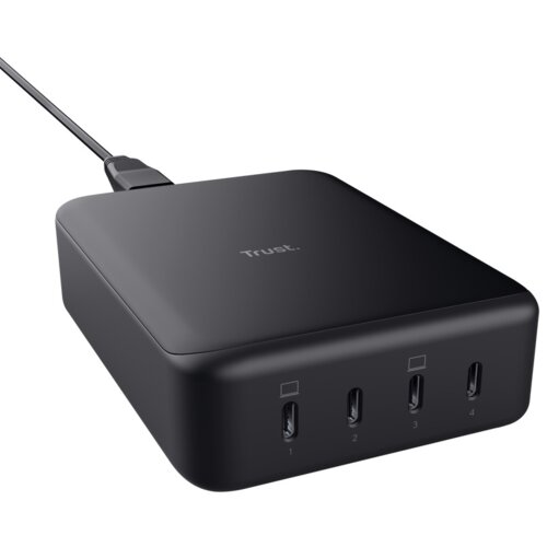 Czarny zasilacz do laptopa z logo "Trust" na górnej powierzchni, posiada cztery porty oznaczone cyframi 1, 2, 3 i 4 na przedniej krawędzi. Kabel zasilający jest podłączony do urządzenia.
