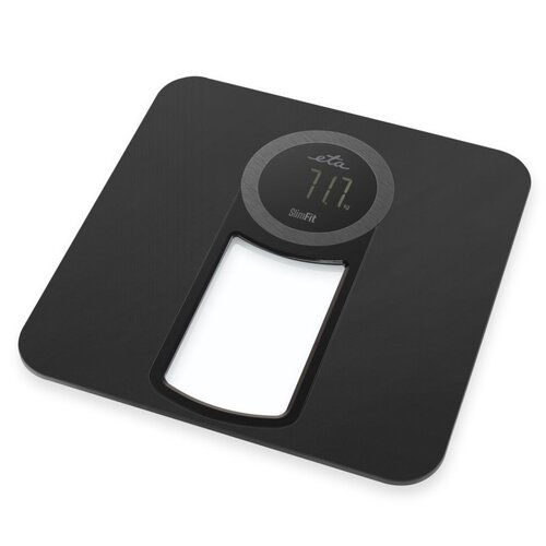 Czarna waga łazienkowa z okrągłym wyświetlaczem pokazującym "71.7 kg", z widocznym logo "eta" oraz napisem "SlimFit". Waga ma prostokątny otwór w dolnej części.