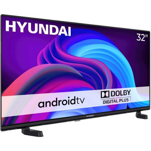 Telewizor z napisem "HYUNDAI" w lewym górnym rogu i "32''" w prawym górnym rogu, na ekranie widoczna jest kolorowa grafika z napisem "android tv" oraz logo "DOLBY DIGITAL PLUS". Na dolnej ramce telewizora znajduje się logo "HYUNDAI".