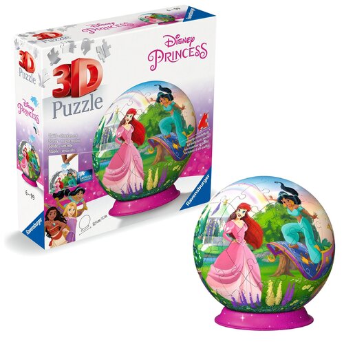 Pudełko z puzzlami 3D przedstawia kolorową kulę z postaciami z bajek Disneya, w tym księżniczkami w różowych i niebieskich strojach, na tle zielonego krajobrazu. Na opakowaniu widnieje napis "3D Puzzle" oraz "Disney Princess", a także logo "Ravensburger" 