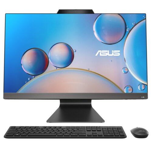 Na zdjęciu znajduje się komputer stacjonarny typu all-in-one z dużym ekranem, na którym widoczne są kolorowe bańki na niebieskim tle oraz logo "ASUS". Przed monitorem umieszczono czarną klawiaturę i myszkę z logo "ASUS".