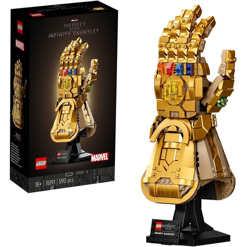 Zestaw LEGO 76191 Marvel Rękawica Nieskończoności przedstawia złotą rękawicę z kolorowymi kamieniami, umieszczoną na czarnej podstawce. Na opakowaniu widnieje napis "LEGO", "INFINITY SAGA", "INFINITY GAUNTLET", "MARVEL", oraz informacje "18+", "76191", "5