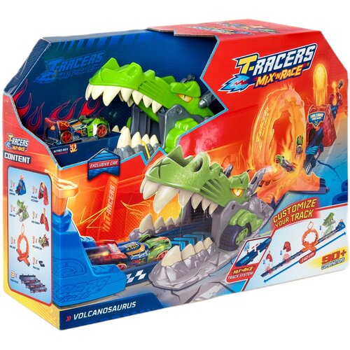 Pudełko z zabawką "T-Racers Mix’n Race Volcano Saurus" przedstawia kolorową wyrzutnię w kształcie zielonego dinozaura z otwartą paszczą, w której znajduje się mały samochodzik. Na opakowaniu widnieją napisy: "T-Racers Mix’n Race", "Customize Your Track", 