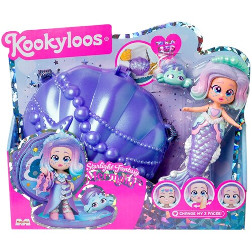 Opakowanie produktu "Lalka MAGIC BOX KookyLoos Mermaid Starlight Fantasy PKLSP104IN280" przedstawia lalkę syrenkę z wymiennymi twarzami, obok której znajduje się duża, fioletowa muszla oraz mała figurka. Na opakowaniu widnieje logo "KookyLoos" oraz napis 