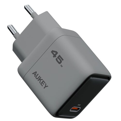 Szara ładowarka sieciowa z dwoma metalowymi bolcami, oznaczona napisem "AUKEY" oraz "45W". Na czarnej części widoczny jest port USB-C z oznaczeniem "PD".