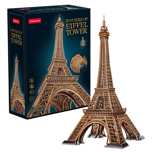 Pudełko z puzzlami 3D przedstawia model Wieży Eiffla, z widocznym napisem "3D PUZZLE OF EIFFEL TOWER" oraz logo "CubicFun". Obok pudełka znajduje się złożony model Wieży Eiffla z 314 elementów, a na opakowaniu widnieje informacja o minimalnym wieku użytko