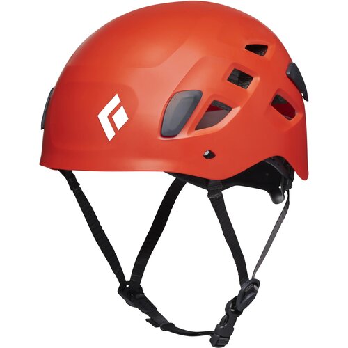 Pomarańczowy kask z kilkoma otworami wentylacyjnymi i regulowanymi paskami, z widocznym białym logo w kształcie rombu. Kask ma gładką powierzchnię i nowoczesny design.