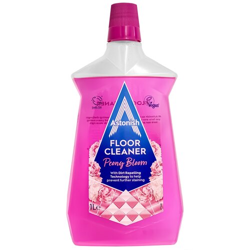 Różowa butelka płynu do mycia podłóg z etykietą zawierającą tekst: "Astonish FLOOR CLEANER Peony Bloom With Dirt Repelling Technology to help prevent further staining". Na etykiecie widoczne są również symbole "Cruelty Free" i "Vegan", a pojemność produkt