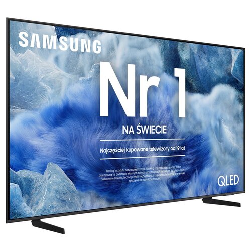 Telewizor z napisem "Nr 1 na świecie" oraz "Najczęściej kupowane telewizory od 19 lat" na tle niebieskich i białych wzorów. Widoczne logo "SAMSUNG" oraz oznaczenie "QLED".