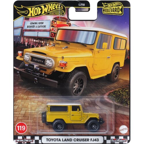 Opakowanie z modelem samochodu Hot Wheels Premium Boulevard przedstawia żółty Toyota Land Cruiser FJ43 na tle kina z neonami. Na opakowaniu widnieje napis "TOYOTA LAND CRUISER FJ43" oraz logo "Hot Wheels Premium Boulevard".