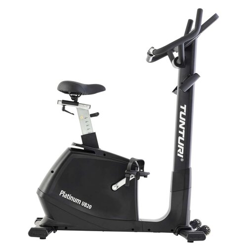 Czarny rower magnetyczny z napisem "Platinum UB20" na obudowie oraz "TUNTURI" na pionowej kolumnie kierownicy. Rower posiada regulowane siodełko i pedały z paskami.