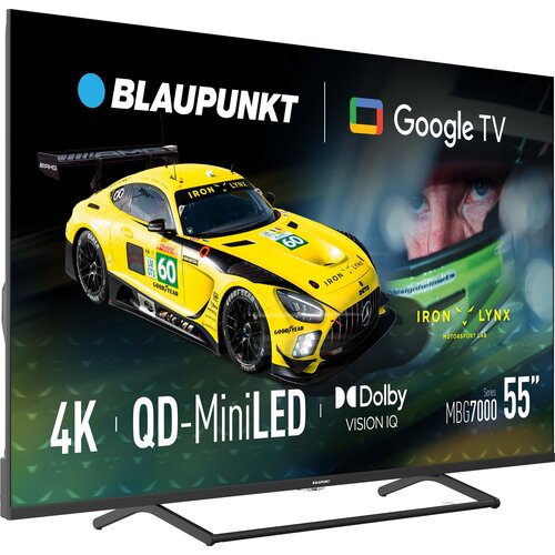 Telewizor wyświetla obraz z żółtym samochodem wyścigowym i twarzą kierowcy w kasku, z widocznymi napisami: "BLAUPUNKT", "Google TV", "4K", "QD-MiniLED", "Dolby Vision IQ", "Series MBG7000", "55”", oraz "IRON LYNX MOTORSPORT LAB".
