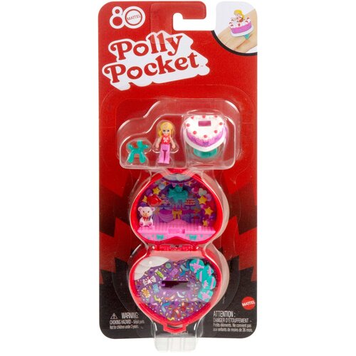 Opakowanie zawiera lalkę Polly Pocket oraz kompaktowy zestaw z motywem urodzinowym, w tym tort i dekoracje. Na opakowaniu widnieje logo "Mattel" oraz napis "Polly Pocket", a także ostrzeżenie o małych elementach.