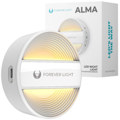 Na zdjęciu znajduje się okrągła lampka nocna z napisem "FOREVER LIGHT" na białej powierzchni, emitująca ciepłe, żółte światło. W tle widoczne jest opakowanie z napisem "ALMA" oraz "LED NIGHT LIGHT WITH MOTION SENSOR", a także logo "FOREVER LIGHT".