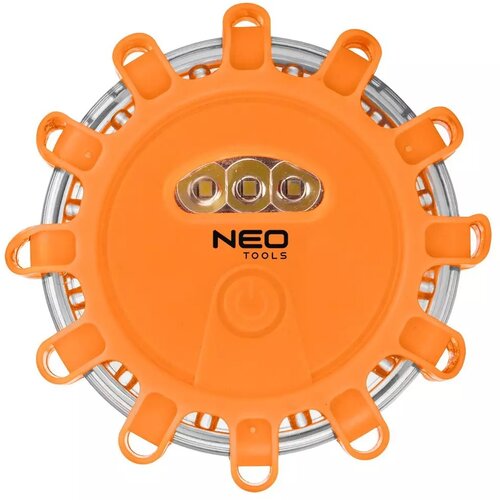 Pomarańczowa flara drogowa z trzema widocznymi diodami LED i napisem "NEO TOOLS" na środku. Produkt ma okrągły kształt z wystającymi uchwytami na obwodzie.