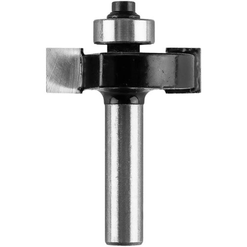 Na zdjęciu widoczny jest metalowy frez z cylindrycznym trzonkiem i ostrzem w kształcie litery T, wykonany z połyskującego metalu. Frez ma ciemne, prawdopodobnie czarne, elementy w centralnej części.