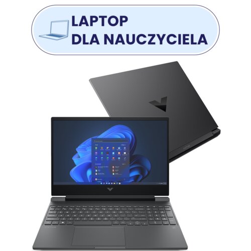Na zdjęciu widoczny jest laptop z otwartym ekranem, na którym wyświetlany jest pulpit systemu Windows, oraz zamknięta pokrywa z logo w kształcie litery "V". Nad laptopem znajduje się napis "LAPTOP DLA NAUCZYCIELA" w niebieskiej ramce z ikoną laptopa.