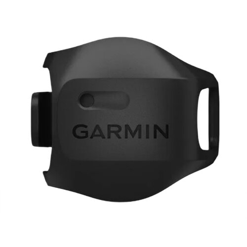 Czarny czujnik prędkości z widocznym logo "GARMIN" na powierzchni. Urządzenie ma zaokrąglony kształt z otworem na jednym końcu.