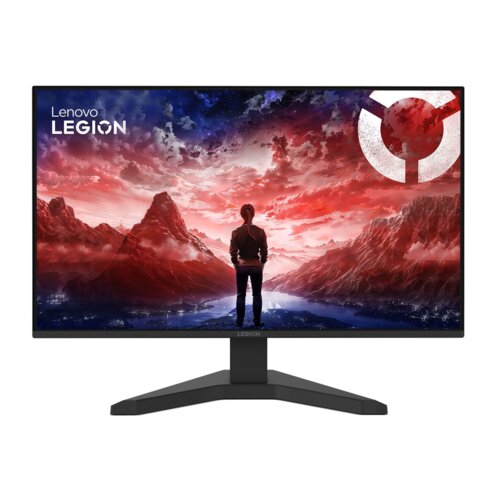 Monitor z cienkimi ramkami wyświetla grafikę przedstawiającą osobę stojącą na tle górskiego krajobrazu o zachodzie słońca, z logo "Lenovo Legion" w lewym górnym rogu. Na ekranie dominuje kolorystyka czerwono-niebieska, a na podstawie monitora widnieje nap