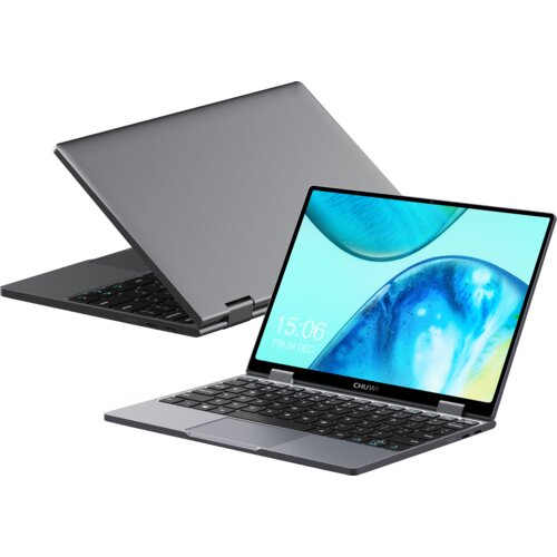 Na zdjęciu widoczny jest laptop z otwartym ekranem, na którym wyświetlany jest obraz z niebieskimi i zielonymi odcieniami oraz zegar pokazujący godzinę 15:06 i datę "FRI, 24 DEC". Obok znajduje się drugi laptop w pozycji zamkniętej, a na dolnej ramce ekra