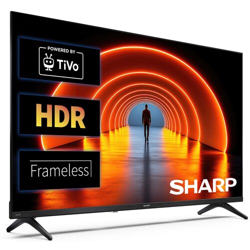 Telewizor z wyświetlaczem pokazującym osobę w tunelu z pomarańczowymi łukami świetlnymi. Na ekranie widoczne są napisy: "Powered by TiVo", "HDR", "Frameless" oraz logo "SHARP".
