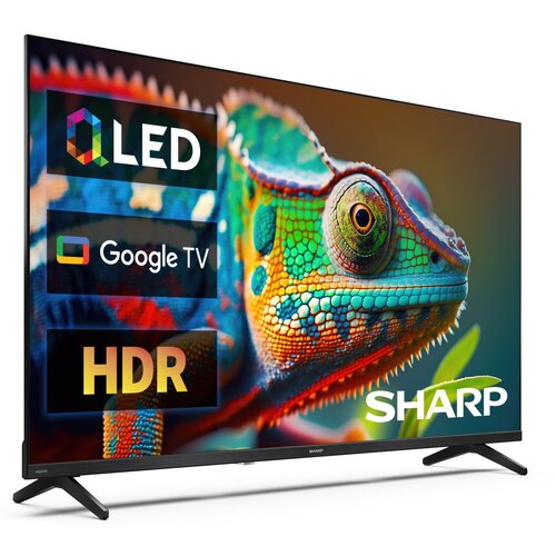 Na zdjęciu widoczny jest telewizor z kolorowym obrazem kameleona na ekranie, z logo "SHARP" w dolnym rogu. Na ekranie znajdują się napisy: "QLED", "Google TV" oraz "HDR".