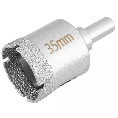 Na zdjęciu znajduje się metalowa otwornica z widocznym napisem "35mm" na jej powierzchni. Krawędź tnąca pokryta jest chropowatym materiałem, a narzędzie ma cylindryczny kształt z uchwytem.
