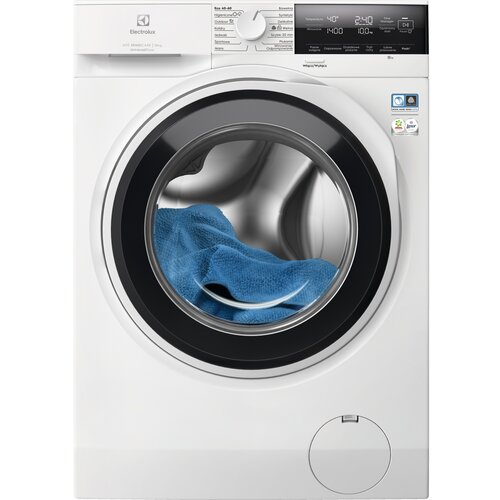 Biała pralka z widocznym okrągłym bębnem, w którym znajduje się niebieski ręcznik. Na panelu sterowania widoczne są napisy: "Electrolux", "ECO 40-60", "40°C", "2:40", "1400", "100%".