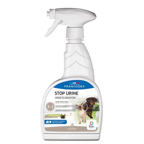 Biała butelka ze spryskiwaczem zawiera etykietę z napisem "LABORATOIRE FRANCODEX STOP URINE URINE ELIMINATOR", a poniżej znajdują się informacje o produkcie, takie jak "Usuwa plamy moczu", "Eliminuje nieprzyjemny zapach" oraz "Zapobiega znakowaniu moczem"