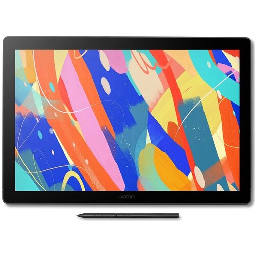 Na zdjęciu znajduje się tablet graficzny z kolorowym, abstrakcyjnym wzorem na ekranie, w intensywnych barwach takich jak niebieski, czerwony, żółty i różowy. Pod ekranem widoczny jest rysik, a na ramce tabletu znajduje się logo "Wacom".