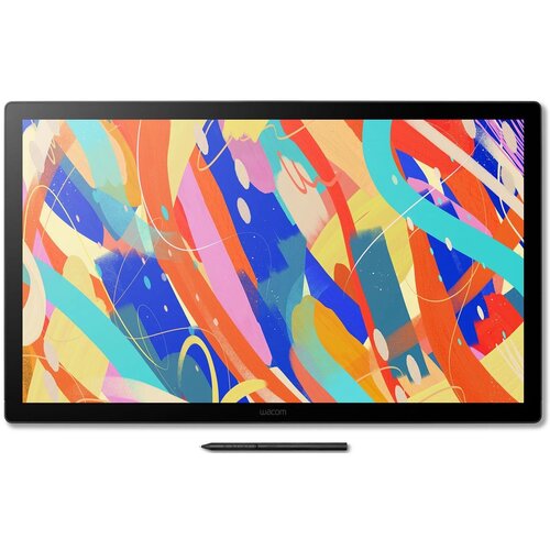 Tablet graficzny z dużym ekranem wyświetlającym kolorową, abstrakcyjną grafikę z dynamicznymi liniami i kształtami w odcieniach czerwieni, niebieskiego, żółtego i zielonego. Na dolnej ramce widoczny jest napis "Wacom", a przed tabletem leży czarny rysik.