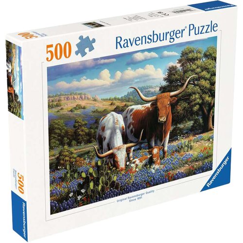 Pudełko puzzli Ravensburger zawiera obraz przedstawiający długorogie krowy na tle malowniczego krajobrazu z kwiatami i wzgórzami. Na opakowaniu widnieje napis "500" oraz "Ravensburger Puzzle", a także informacja "Original Ravensburger Quality Since 1891".
