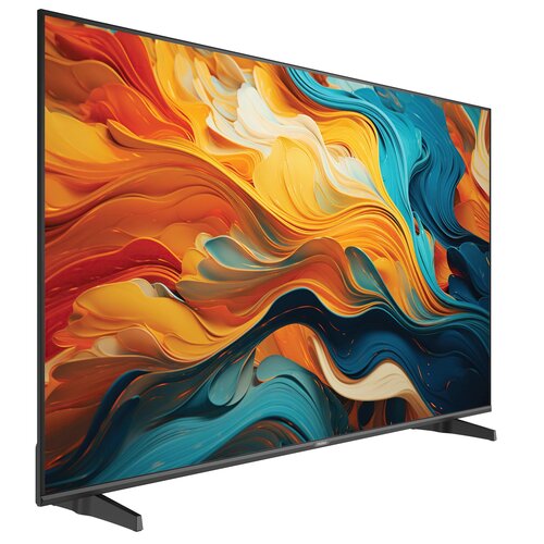 Telewizor z dużym ekranem wyświetla abstrakcyjną grafikę w intensywnych kolorach pomarańczowym, niebieskim i białym. Na dolnej ramce widoczne jest logo "Haier".