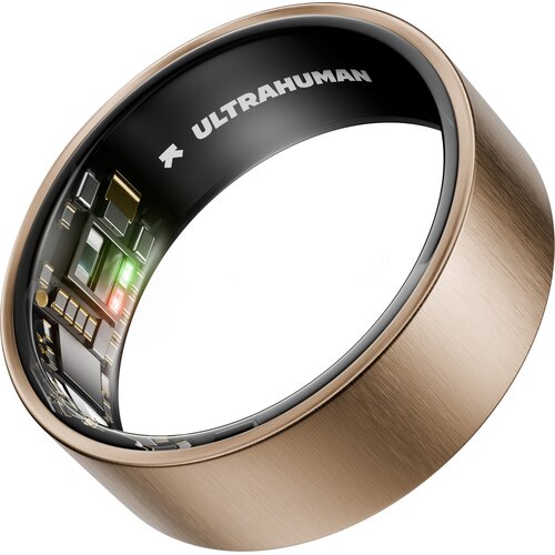 Pierścień w kolorze różowego złota z widocznymi elementami elektronicznymi wewnątrz, na czarnej powierzchni wewnętrznej znajduje się napis "ULTRAHUMAN".