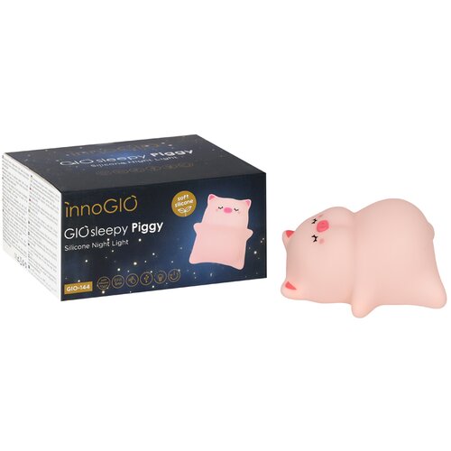 Pudełko z napisem "innoGIO GIOsleepy Piggy Silicone Night Light" oraz "GIO-144" obok silikonowej lampki w kształcie świnki. Na opakowaniu widnieje grafika przedstawiająca różową świnkę oraz ikony funkcji produktu.
