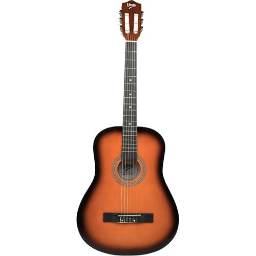 Na zdjęciu znajduje się klasyczna gitara w wykończeniu sunburst, z sześcioma strunami i widocznym logo "V-TONE" na główce. Korpus gitary ma ciemniejsze krawędzie i jaśniejszy środek, a wokół otworu rezonansowego widoczne są ozdobne pierścienie.