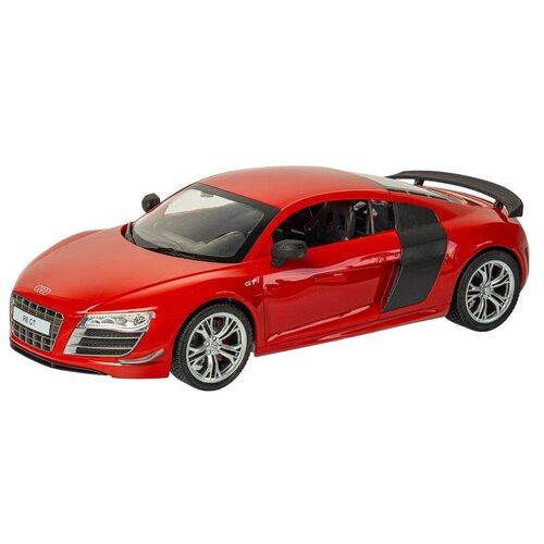 Czerwony zdalnie sterowany samochód sportowy z widocznym logo Audi na masce, posiada srebrne felgi i czarne elementy na drzwiach oraz tylnym spojlerze. Na tablicy rejestracyjnej widnieje napis "R8 GT".
