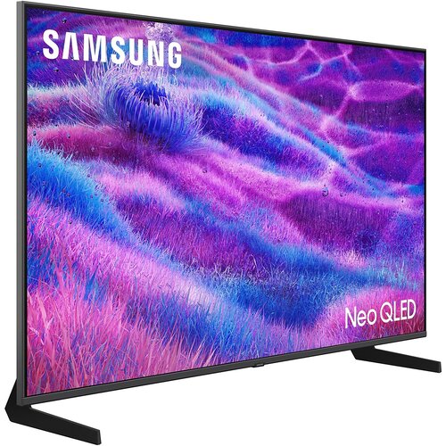 Telewizor z cienką ramką wyświetla obraz w intensywnych odcieniach fioletu i niebieskiego, przypominający falujące pole trawy. W lewym górnym rogu ekranu widoczne jest logo "SAMSUNG", a w prawym dolnym rogu napis "Neo QLED".